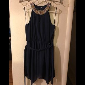 Navy blue dress, tribal pattern beaded collar.